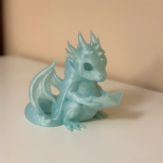 Светеща статуетка четящ дракон