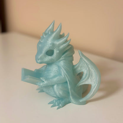 Светеща статуетка четящ дракон