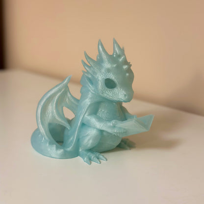 Светеща статуетка четящ дракон